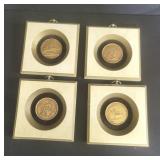 Four vintage framed ceramic medallions