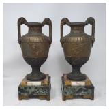 Pair of spelter urns on marble bases