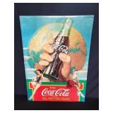 Vintage metal Coca-Cola advertisement