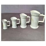 Set of 4 antique lead graduated measuring