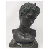 Stone bronze colored bust on a marble base
