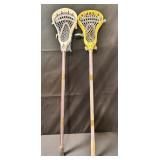 Pair of Warrior lacrosse sticks