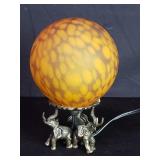 Glass sphere light on tree elephant brass stand
