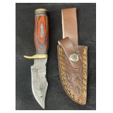 Damascus steel fixed blade knife.