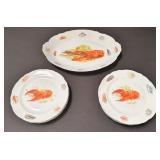 Group of hand painted porcelain plates and platter