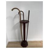 Vintage wood cane stand with three wood canes