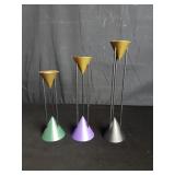 Three mid century metal candlesticks