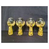Four antique glass ball and cast iron feet