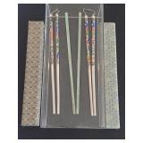 Group of vintage Asian chopsticks utensils with