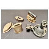 Group of vintage irons, cowbell and headlamp