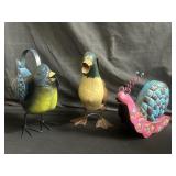 Trio of garden decor watering cans
