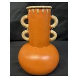 Orange terracotta vase with rattan trimming