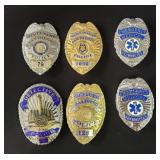 Four movie prop police badges and two emergency