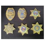 Six movie prop police badges