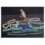 Bag of costume jewelry necklaces
