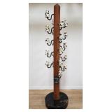 Vintage hat rack with porcelain paperweights by