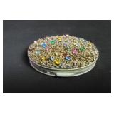 Vintage metal compact with multicolor stones