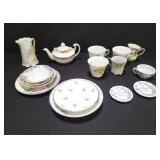 Group of teacups, saucers and teapot