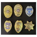 Five movie prop police badges and one medical