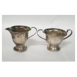 Pair of vintage sterling silver weighted creamer
