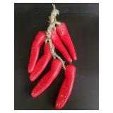Hanging ceramic red chili peppers
