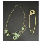 Brass safety pin with Art Nouveau-style necklace
