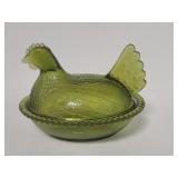 Vintage hen sitting on a nest glass covered bowl