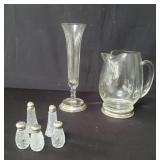 Group of salt and pepper shakers with sterling