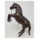 Carved wood figure with leather details