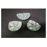 Three plastic and mother of pearl small bowls