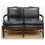 Colonial-style faux leather & walnut love seat