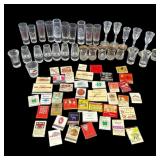 Lot of vintage shot glasses & match books