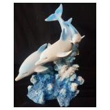 Composite dolphin sculpture