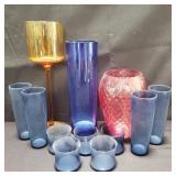 Group of colored glass cups and vases