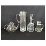 Group of glass decanters pitchers and teapot