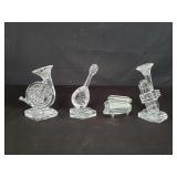 Four glass musical instruments
