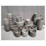 Group of Pottery Barn tea cups and saucers