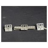 Silver cufflinks and silver tie clip