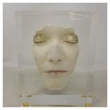 Face mold in acrylic display case