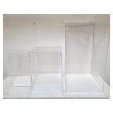 Group of acrylic doll display cases, 3