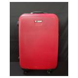 Red hardshell Delsey suit case