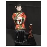 Asian ceramic figurine with stand and base