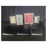 Group of picture frames and photo albums