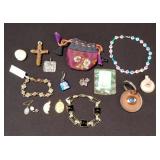 Group of costume pendants, bracelet, and key chain