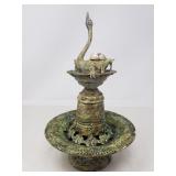 Signed and dated swan face metal artwork