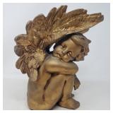 Ceramic cherub statue