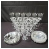 Collection of etched glassware and saucers