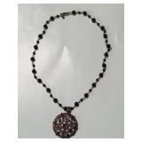 Sterling silver pendant with garnets, purple