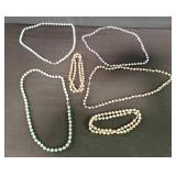 Six Asian cloistered beaded necklaces