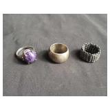 Group of sterling silver rings, one with amethyst
